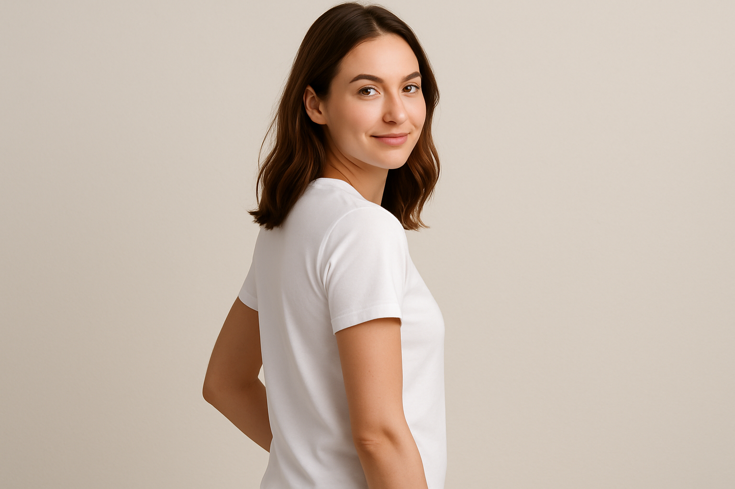 a young lady wearing a white tshirt posing to show the side of the tshrit